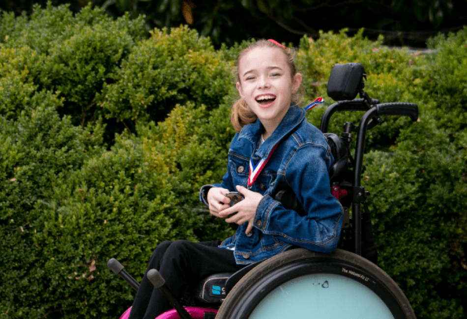 Madison Rogers, a young girl using a motorized wheelchair